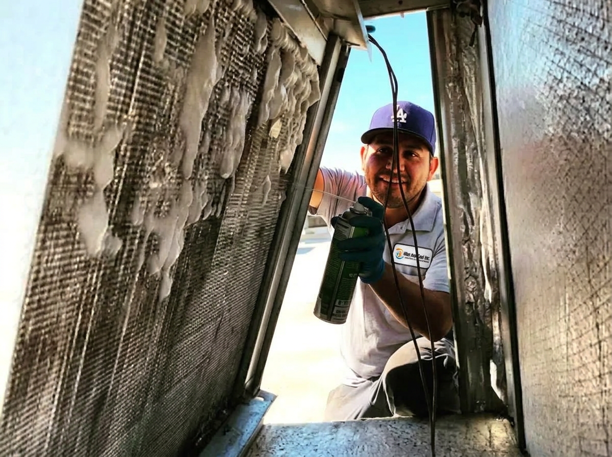 Nice And Cool technician performing duct and air-handler service