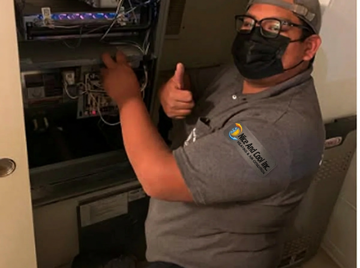 Nice And Cool technician reviewing HVAC equipment for a second opinion